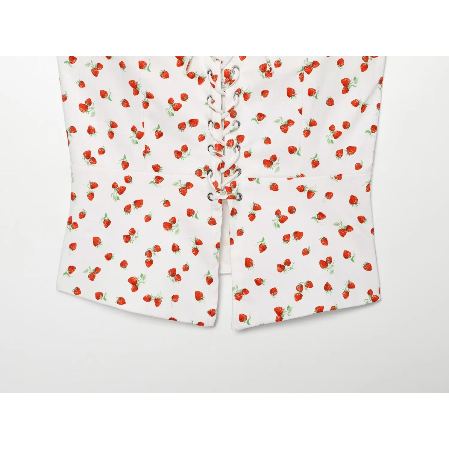 Waist and split hem flat detail shot white strawberry print camisole top