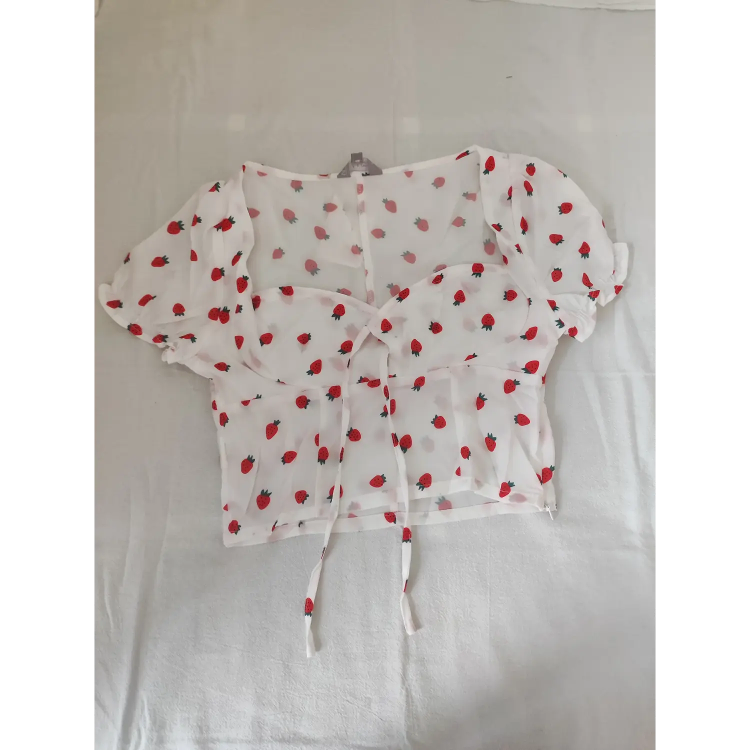 Flat lay front white square neck tie front crop top all over red strawberry print