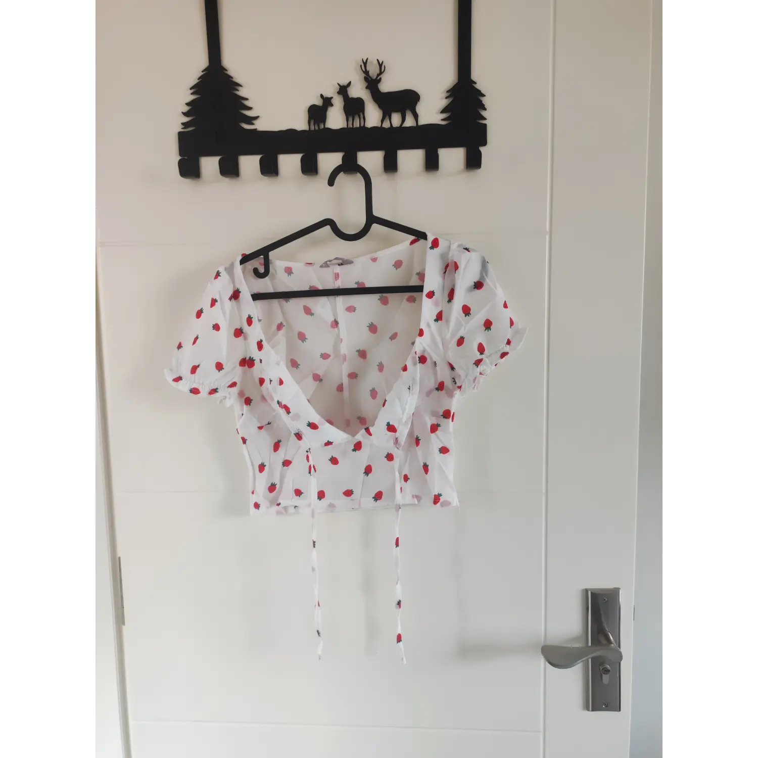 Hanging front shot square neck tie front strawberry print cropped blouse on hanger
