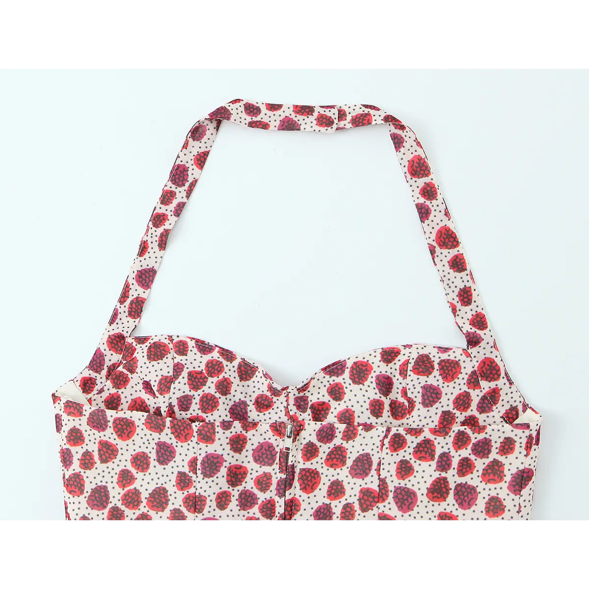 Back view of the strawberry print halter top, showing the center zipper and halter strap closure
