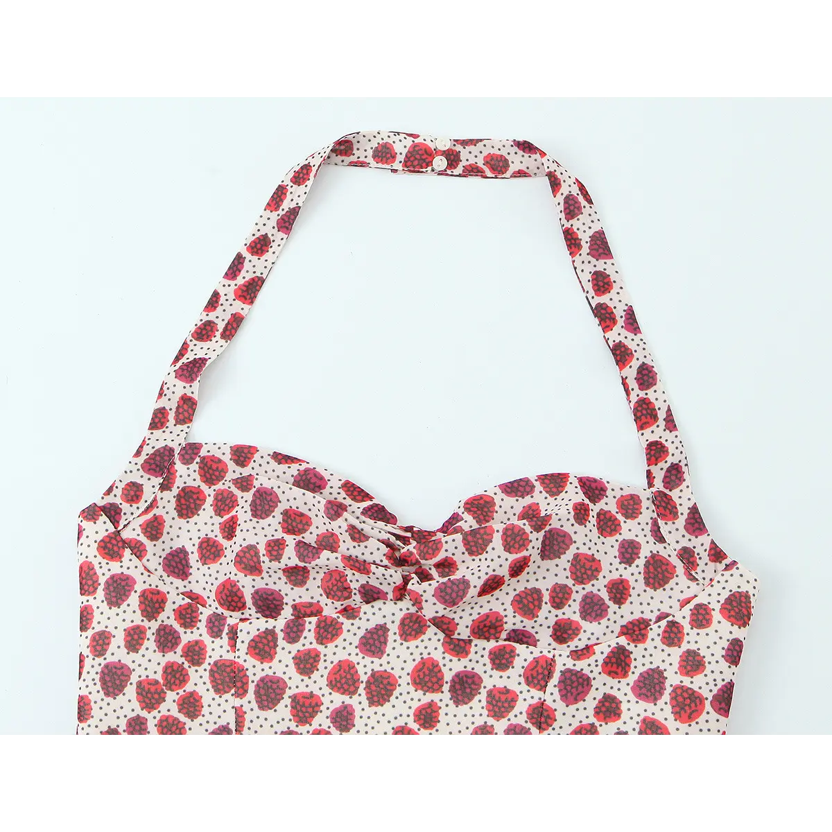 Front view of the strawberry print halter top, showing the halter neck strap, sweetheart neckline, and all-over print