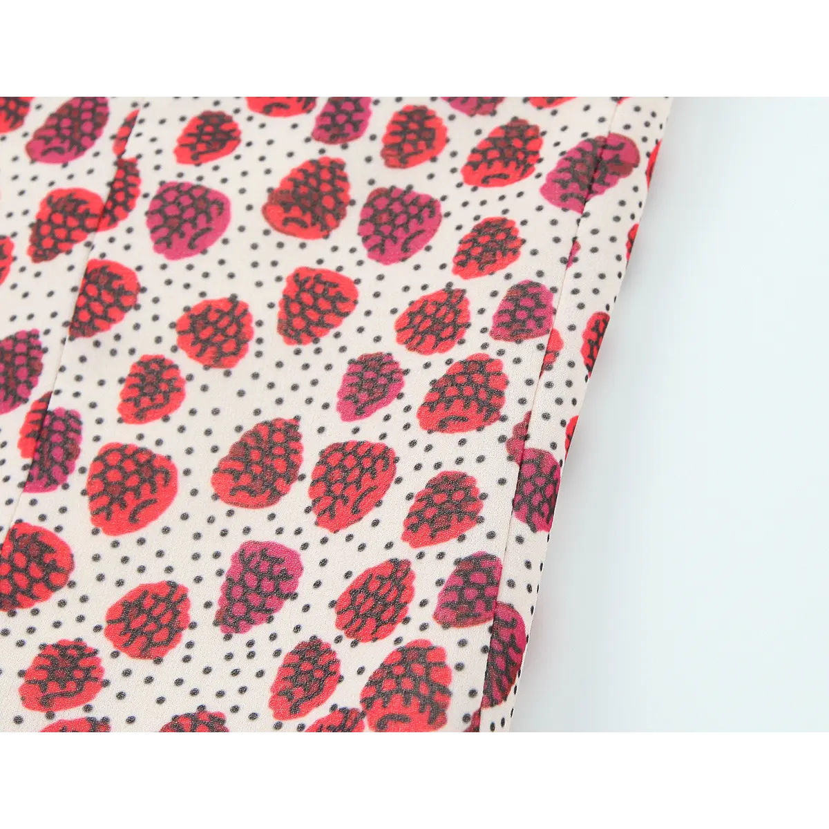 Side view of the strawberry print halter top, highlighting the princess seams and polka dot/strawberry pattern
