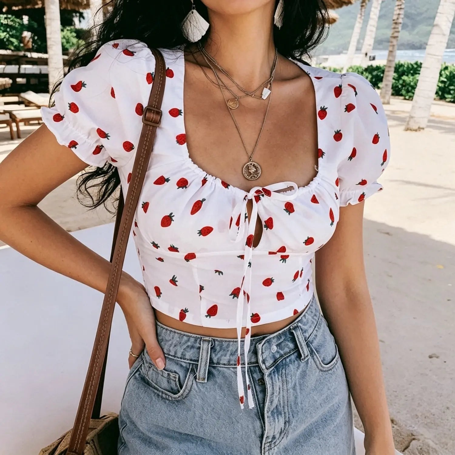 Beach model pose white strawberry printed short sleeve cropped blouse front view