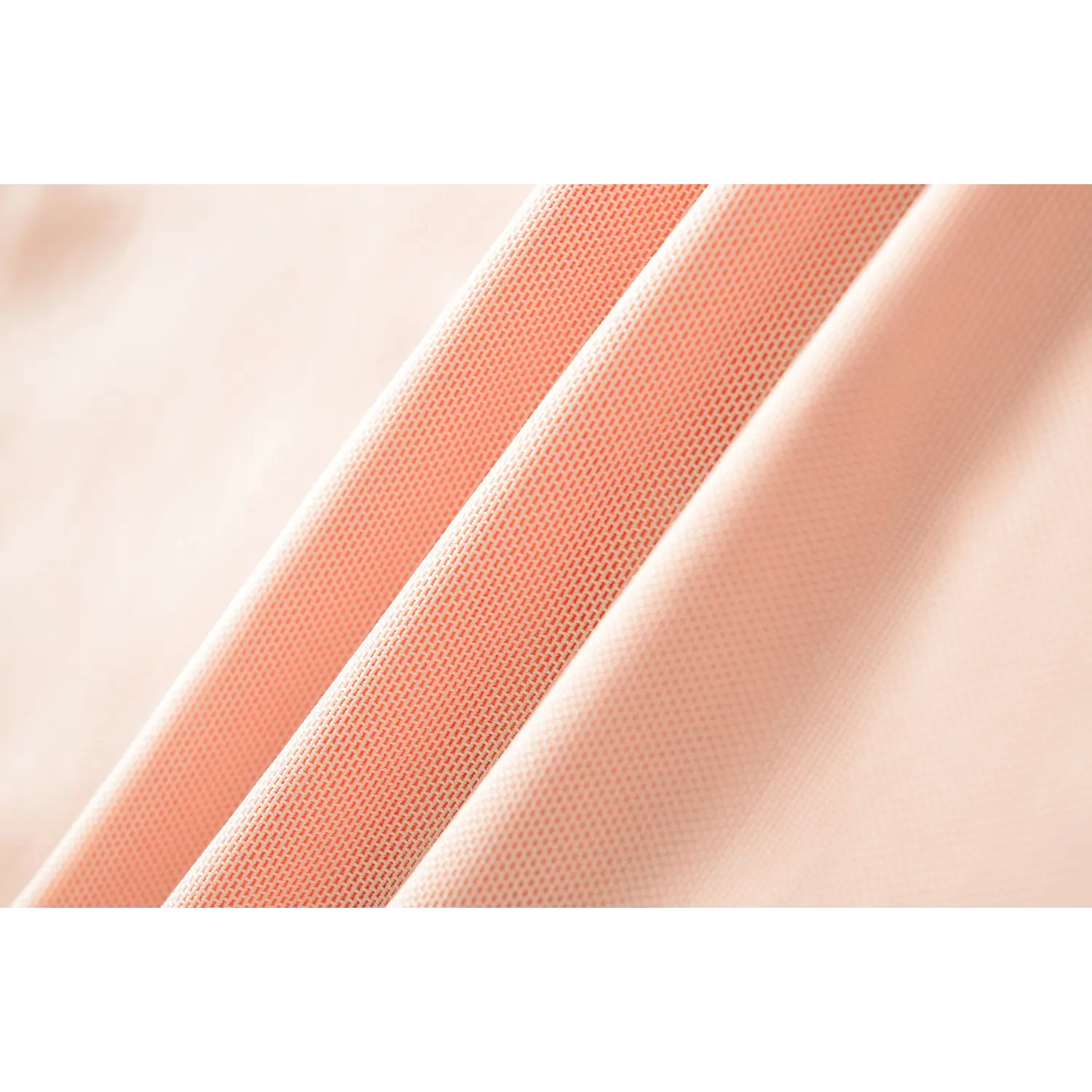 Stretch breathable mesh fabric macro flat close-up, fine uniform mesh texture thin draping double color block mesh cloth white background craft shot