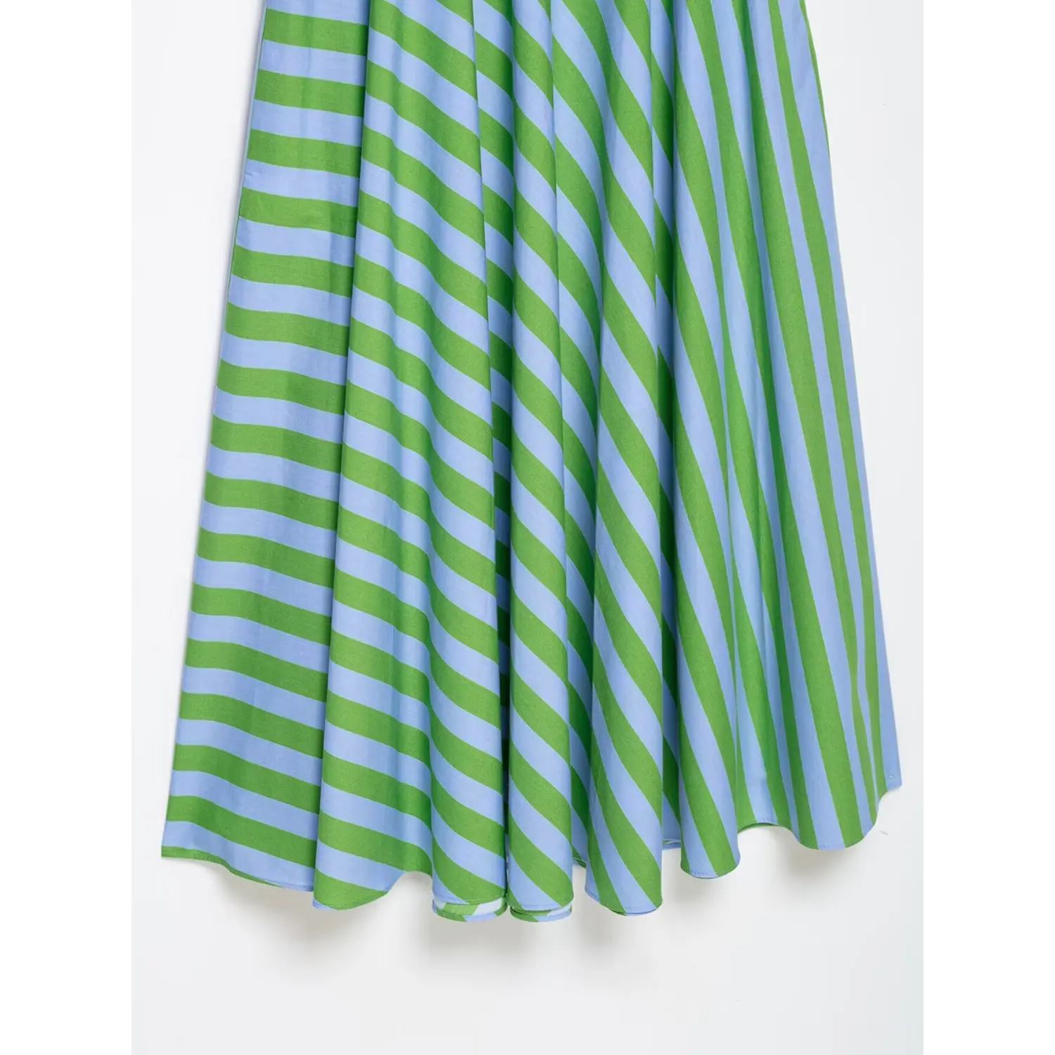 Close-up of diagonal stripe fabric drape and flared hem on green blue camisole midi dress