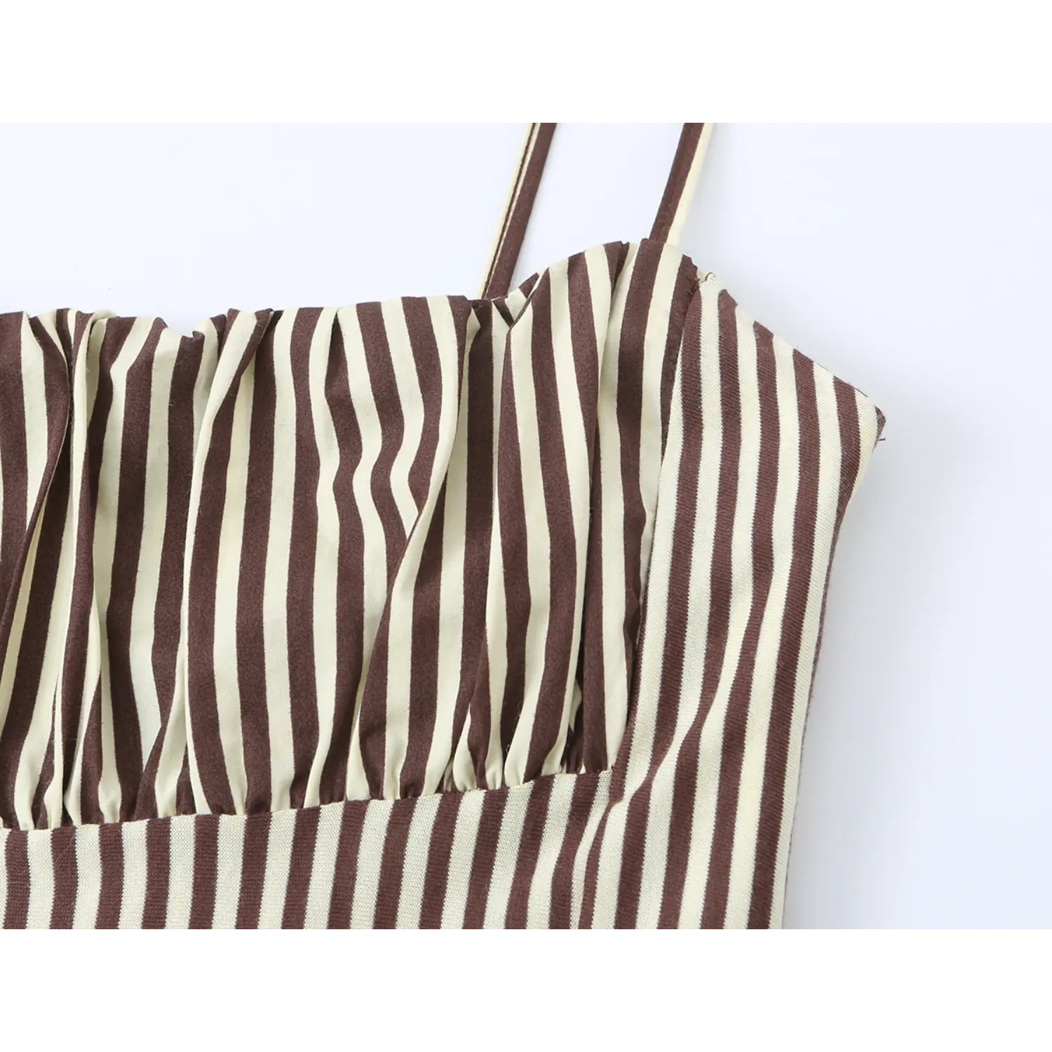 Macro shot of chest gathering fabric on brown white striped cami midi dress