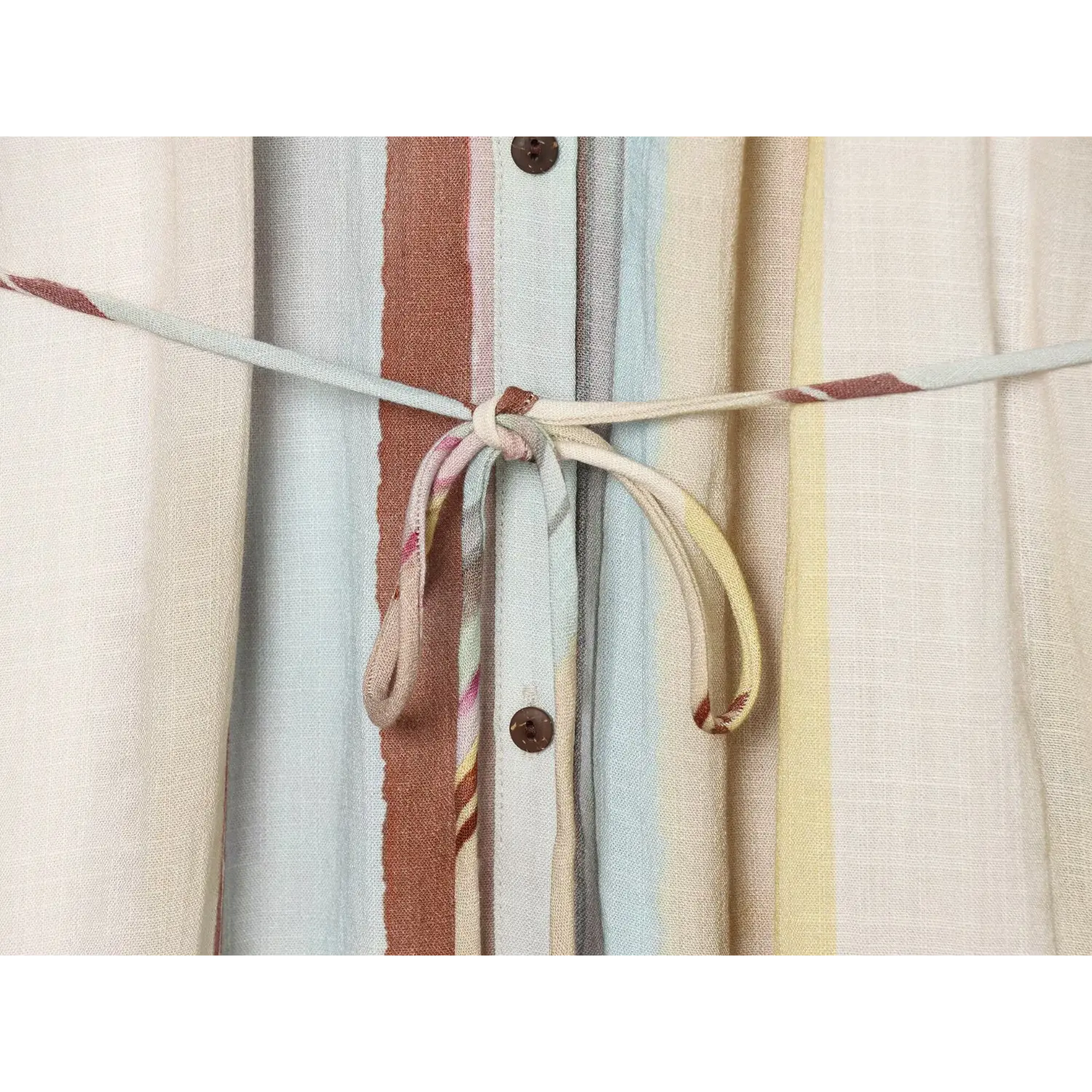 Detailed shot of fabric waist tie knotted at front of striped midi dress