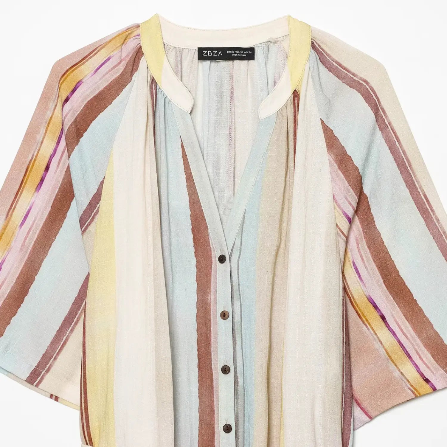 Close‑up of striped midi dress split v‑neck, front coconut buttons and gathered shoulder yoke
