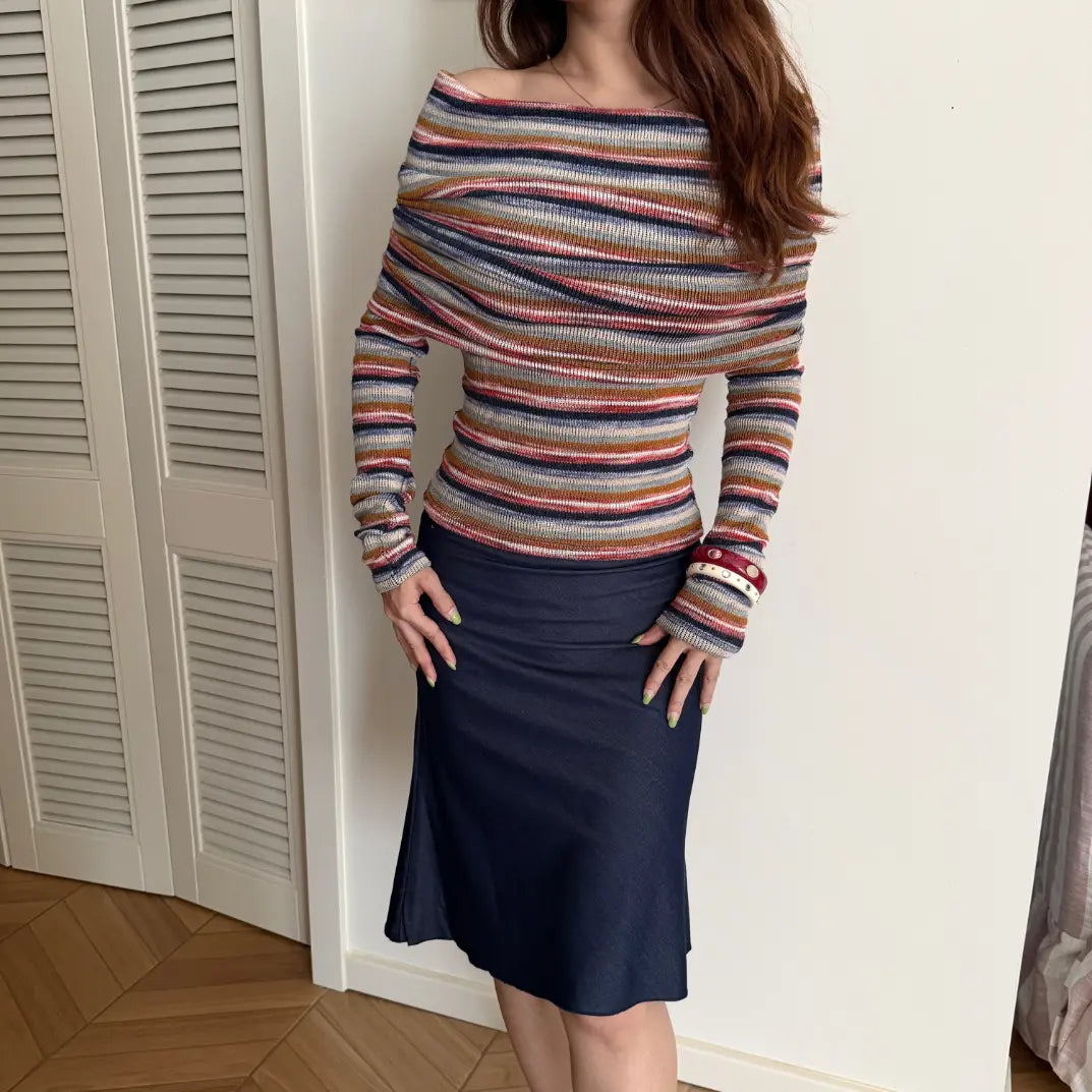 Model wearing stripe off shoulder cowl neck fitted knit top with navy midi skirt, full view
