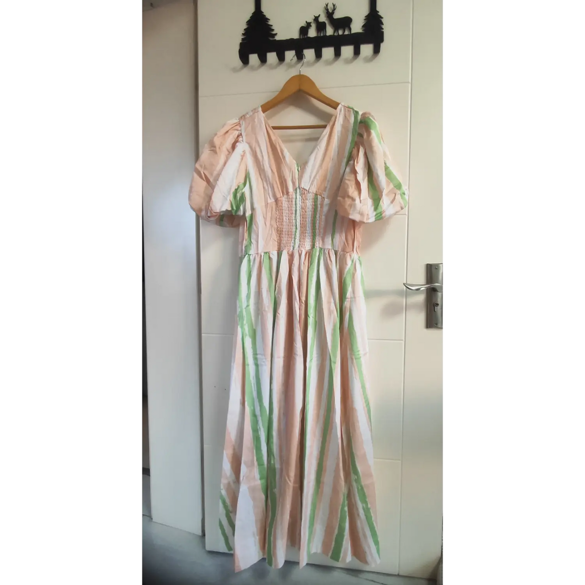 Pink green white brushstroke stripe maxi dress, v neck, puff short sleeves, smocked waist, hanging on wooden hanger