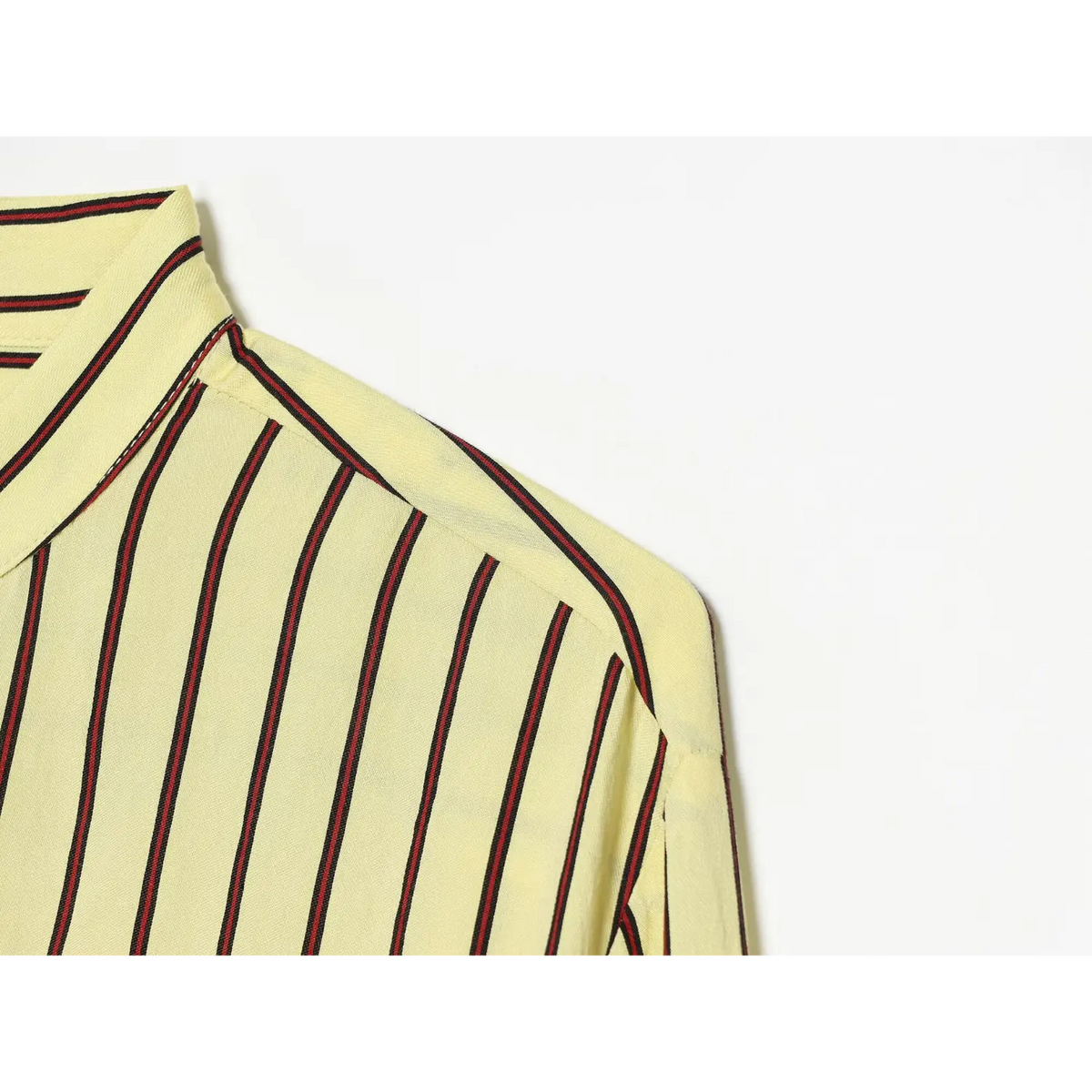 Close-up of drop shoulder seam on stripe shirt