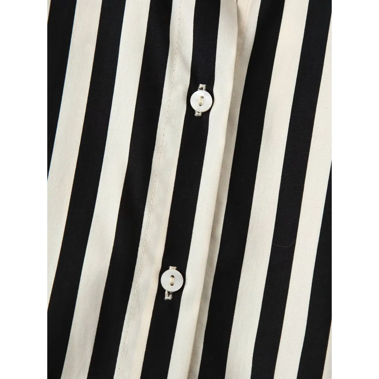 Macro close‑up of round shell buttons on striped shirt front placket, neat stitching and vertical stripe pattern
