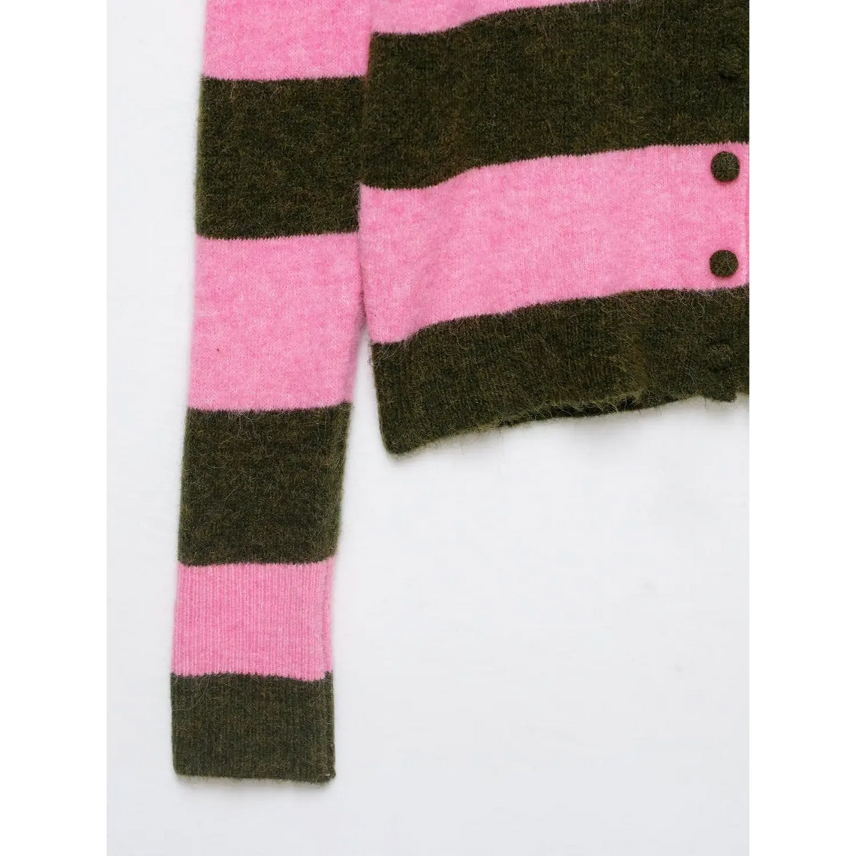 Close-up of ribbed cuff and front buttons
