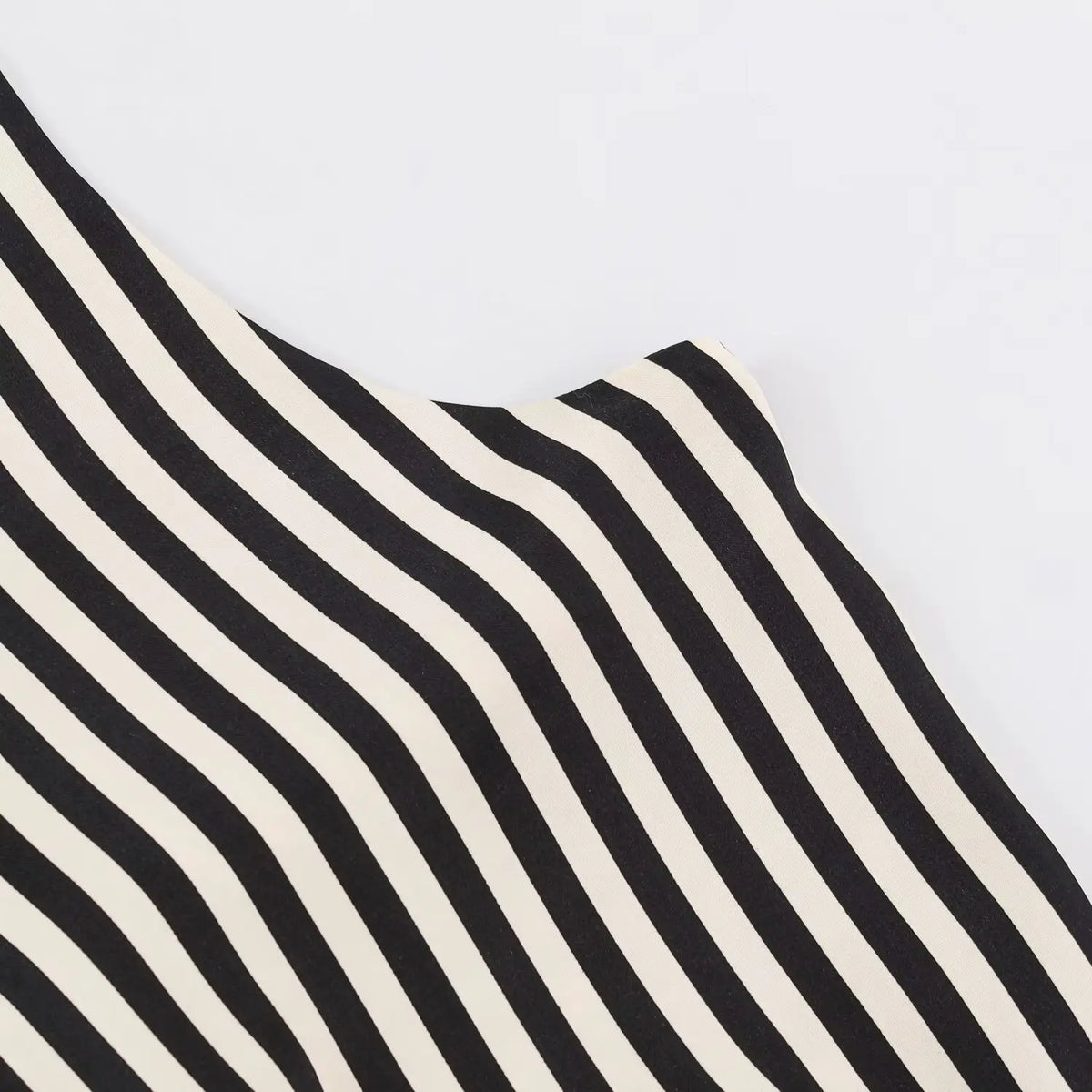 Close-up of armhole and vertical stripe fabric