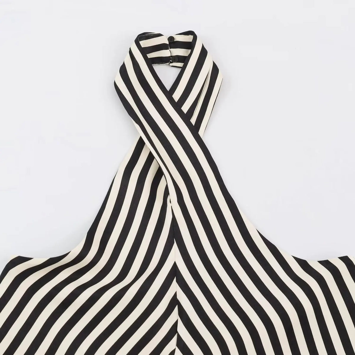 Close-up of crisscross halter neck and back button