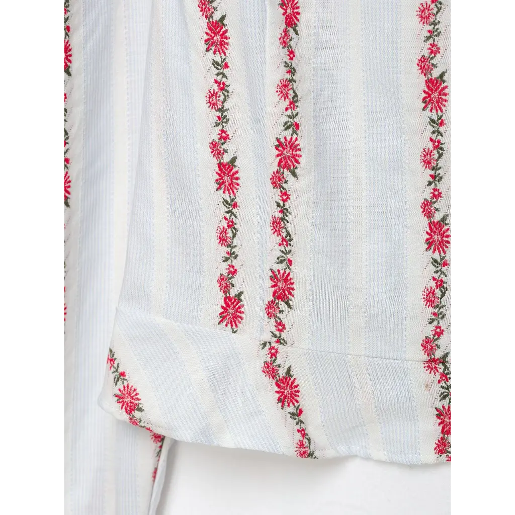 Close-up of folded cuff and floral stripe