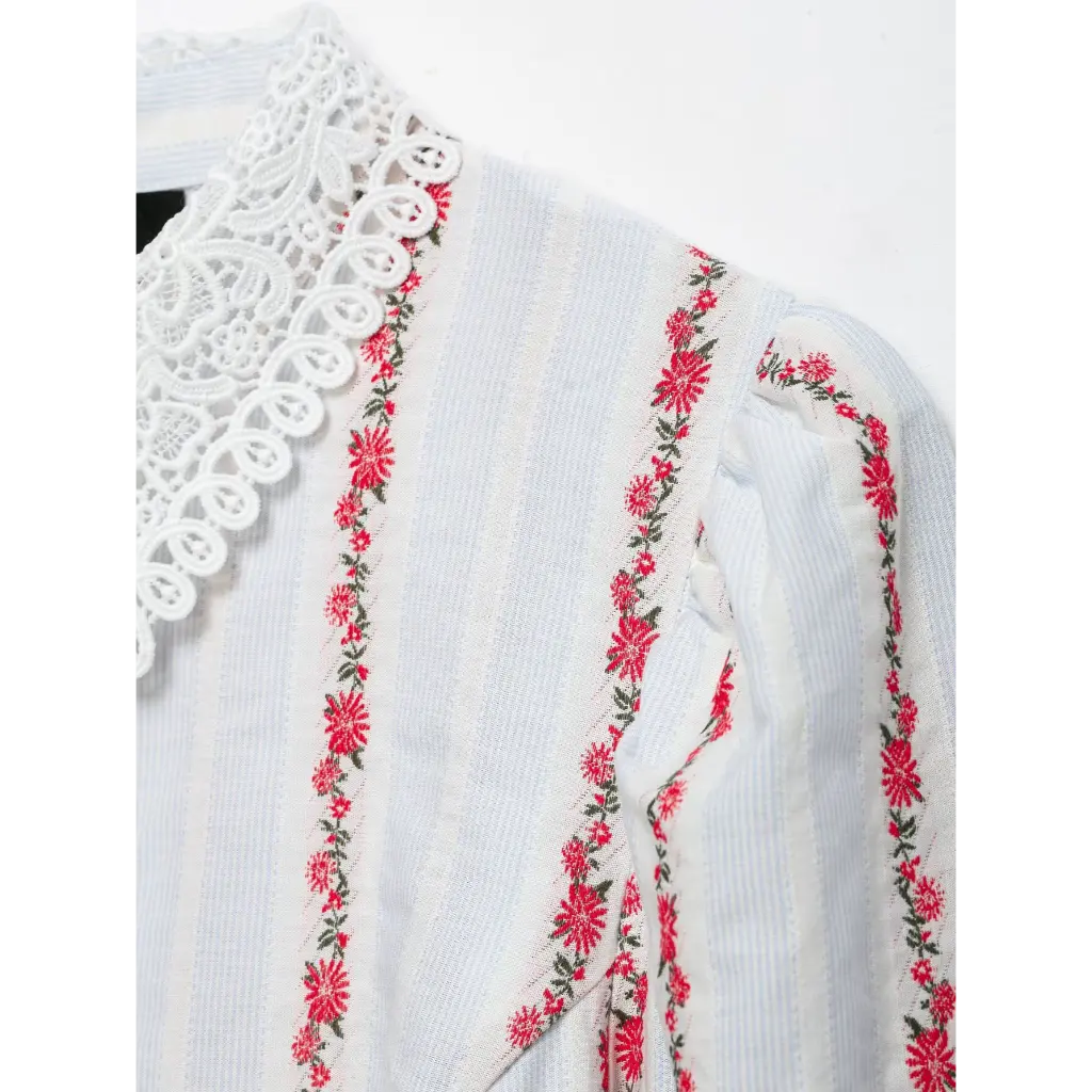 Close-up of puffed shoulder and floral stripe