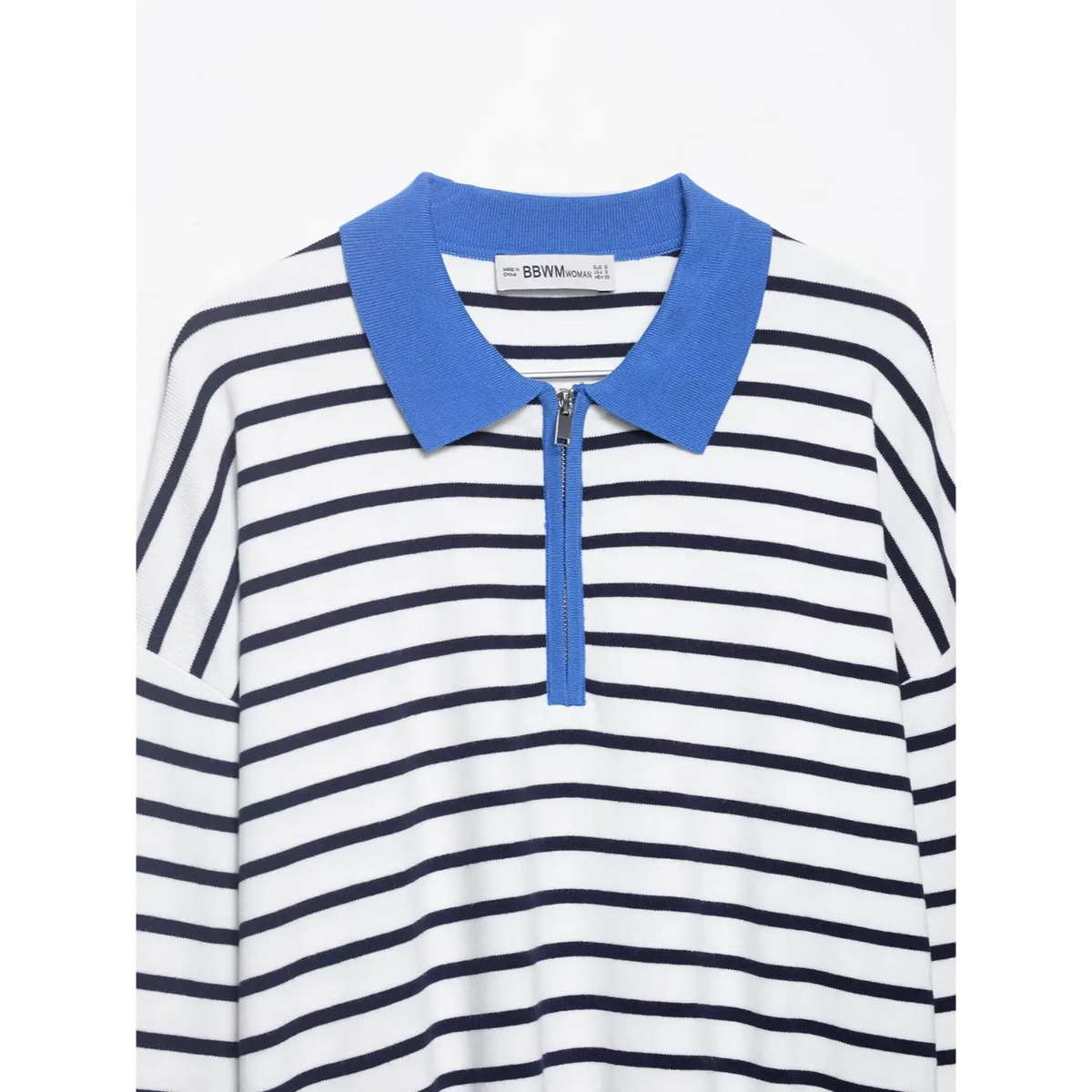 Close-up of collar, half zip and inner label