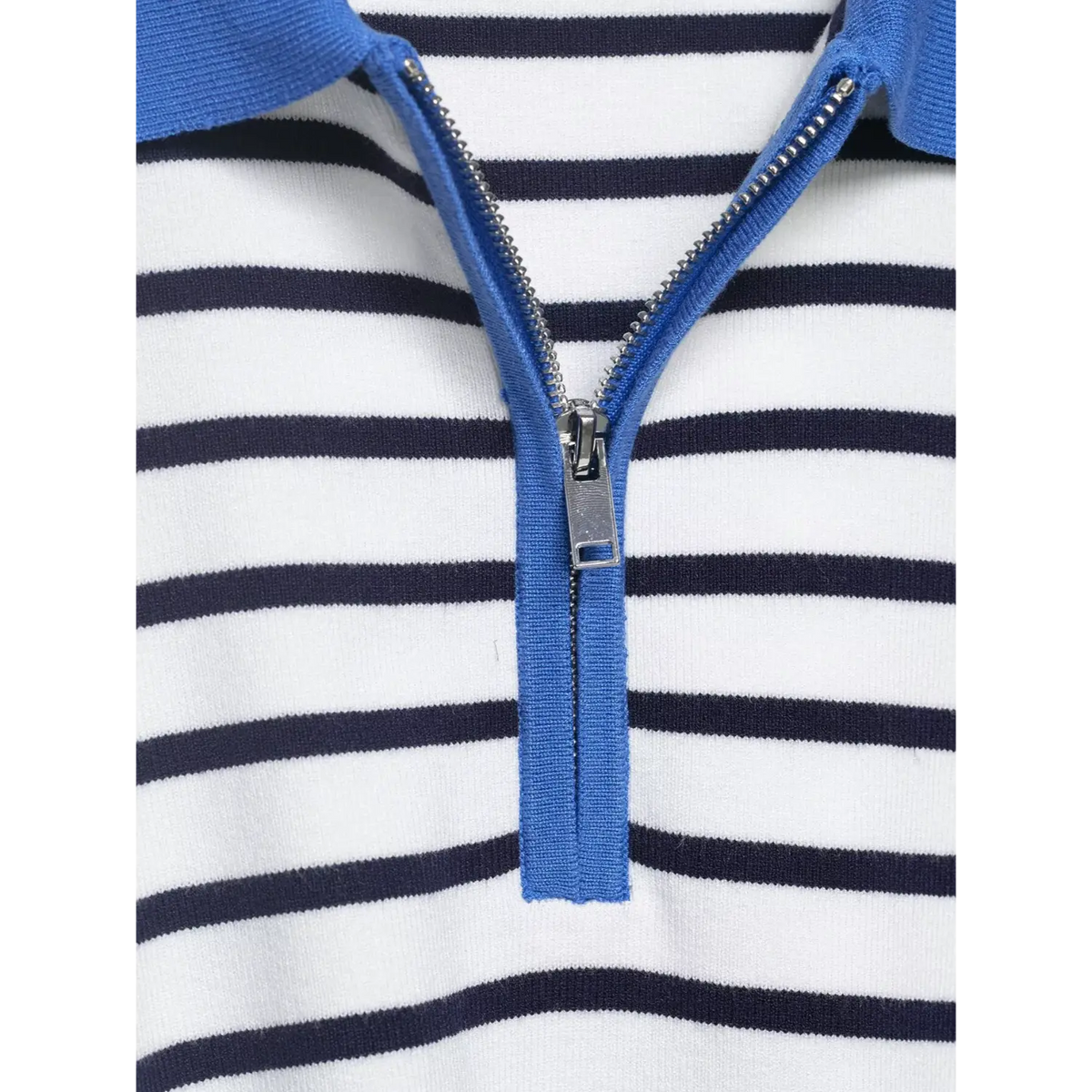 Close-up of metal zipper teeth and blue placketpattern