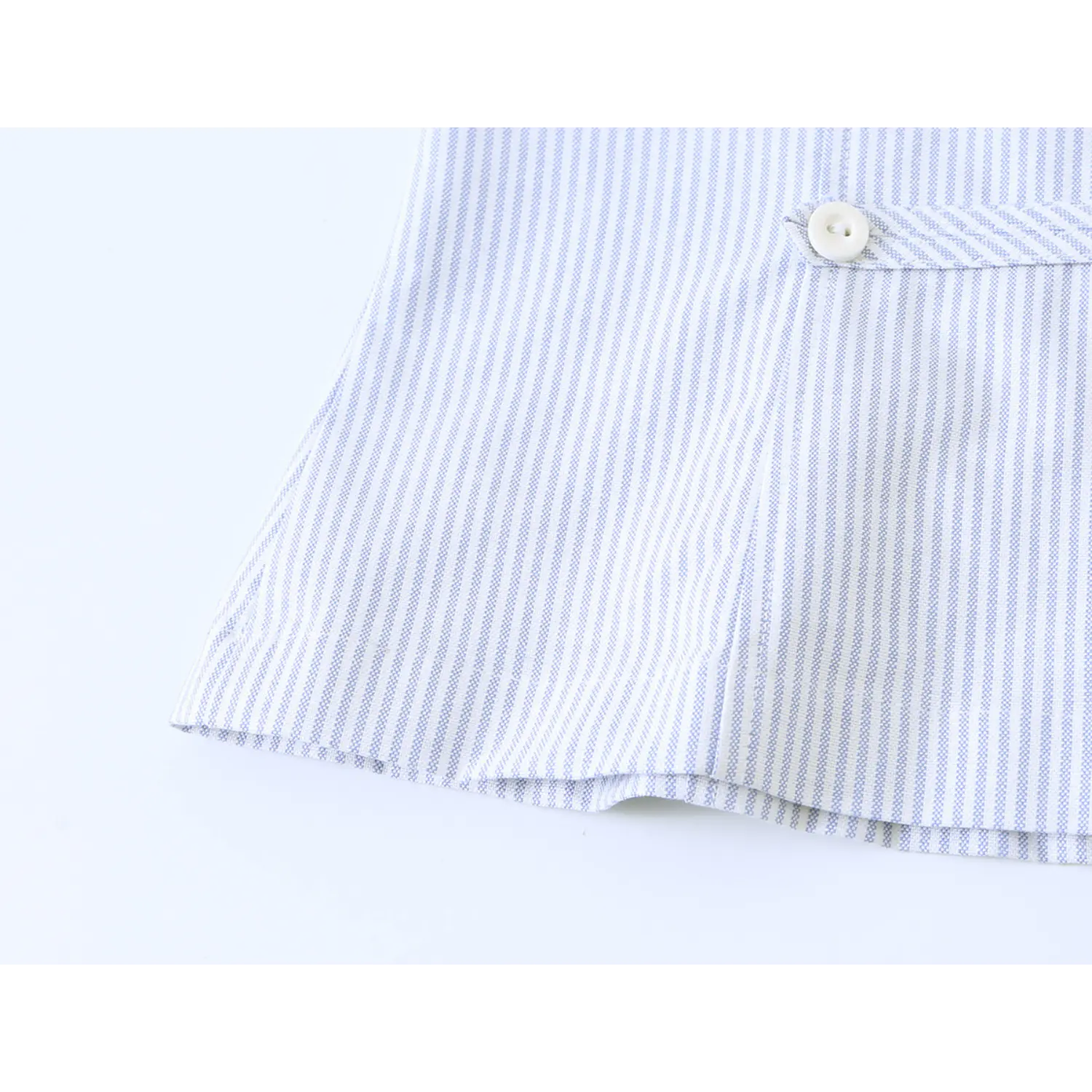 Bottom hem fabric close-up, tailored blue white striped halter sleeveless blouse