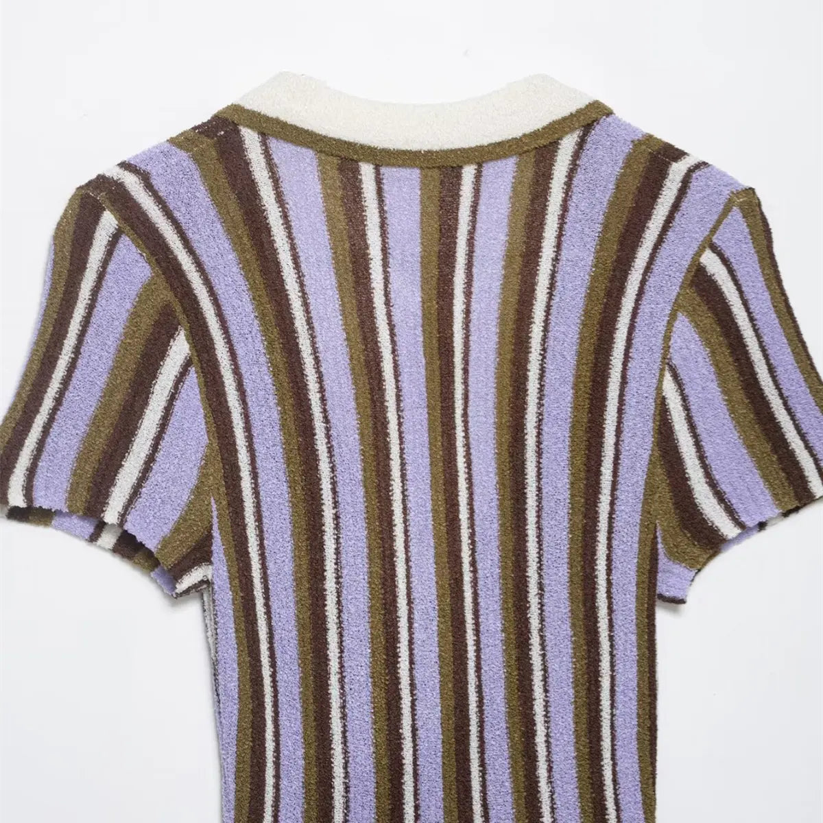 Close-up of the back neckline on the striped knit mini dress, showing the contrast white collar trim and vertical stripes