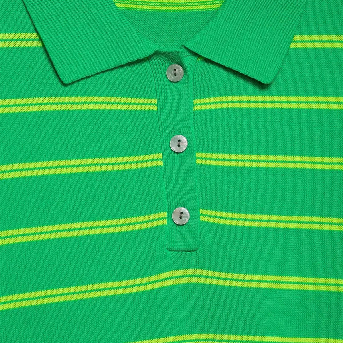 Close-up of the placket on the green and yellow striped knit polo shirt, showing the mother-of-pearl buttons and ribbed collar