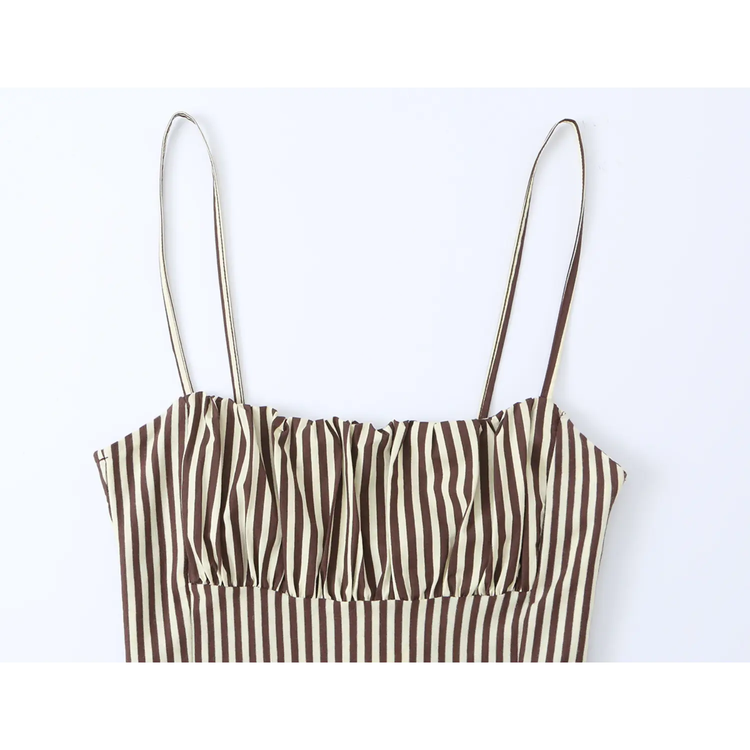 Close up of ruched bust detail on brown white vertical stripe spaghetti strap midi dress