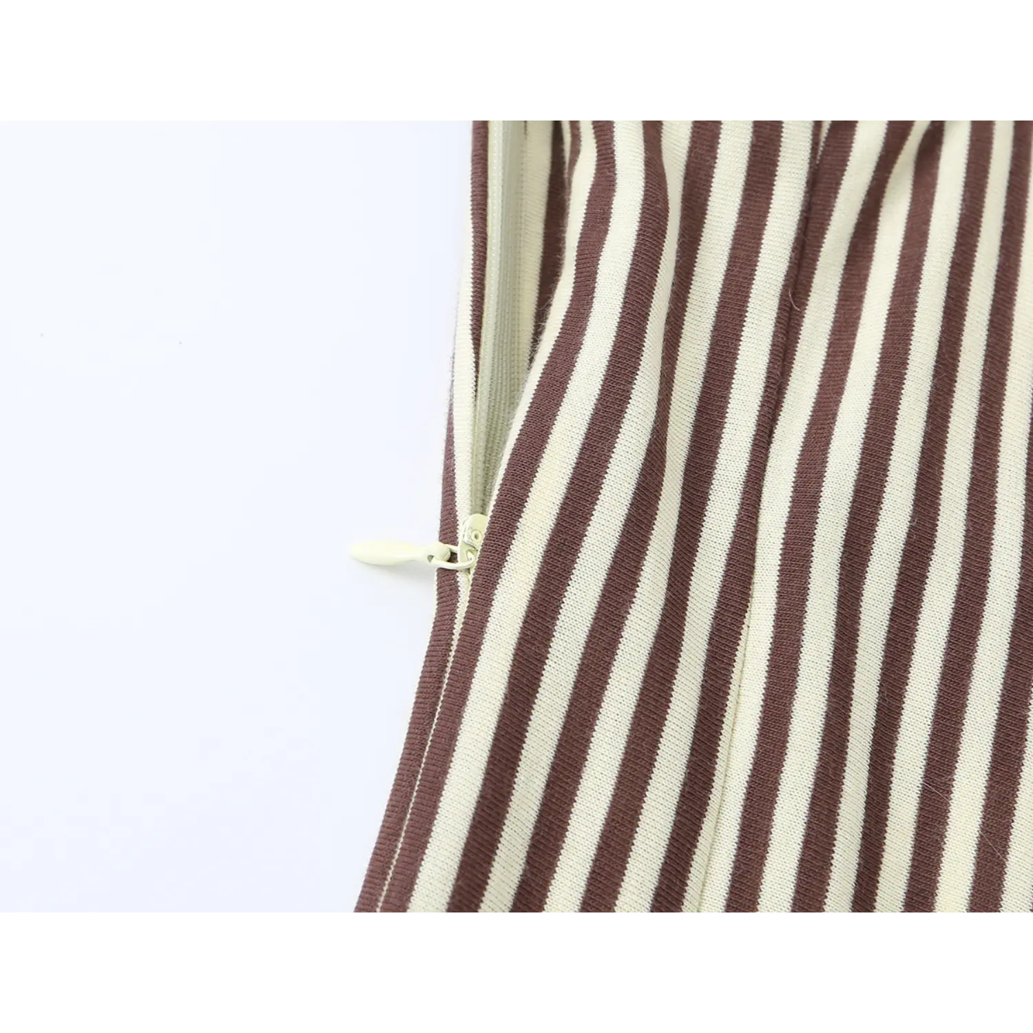 Side invisible zipper closeup on brown white vertical stripe cami midi dress