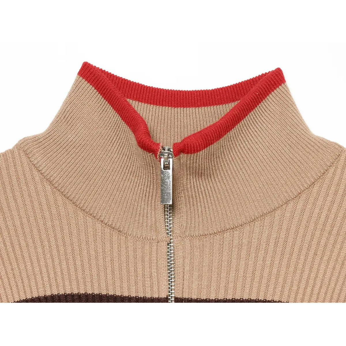Close-up of metal zipper pull and red contrast trim