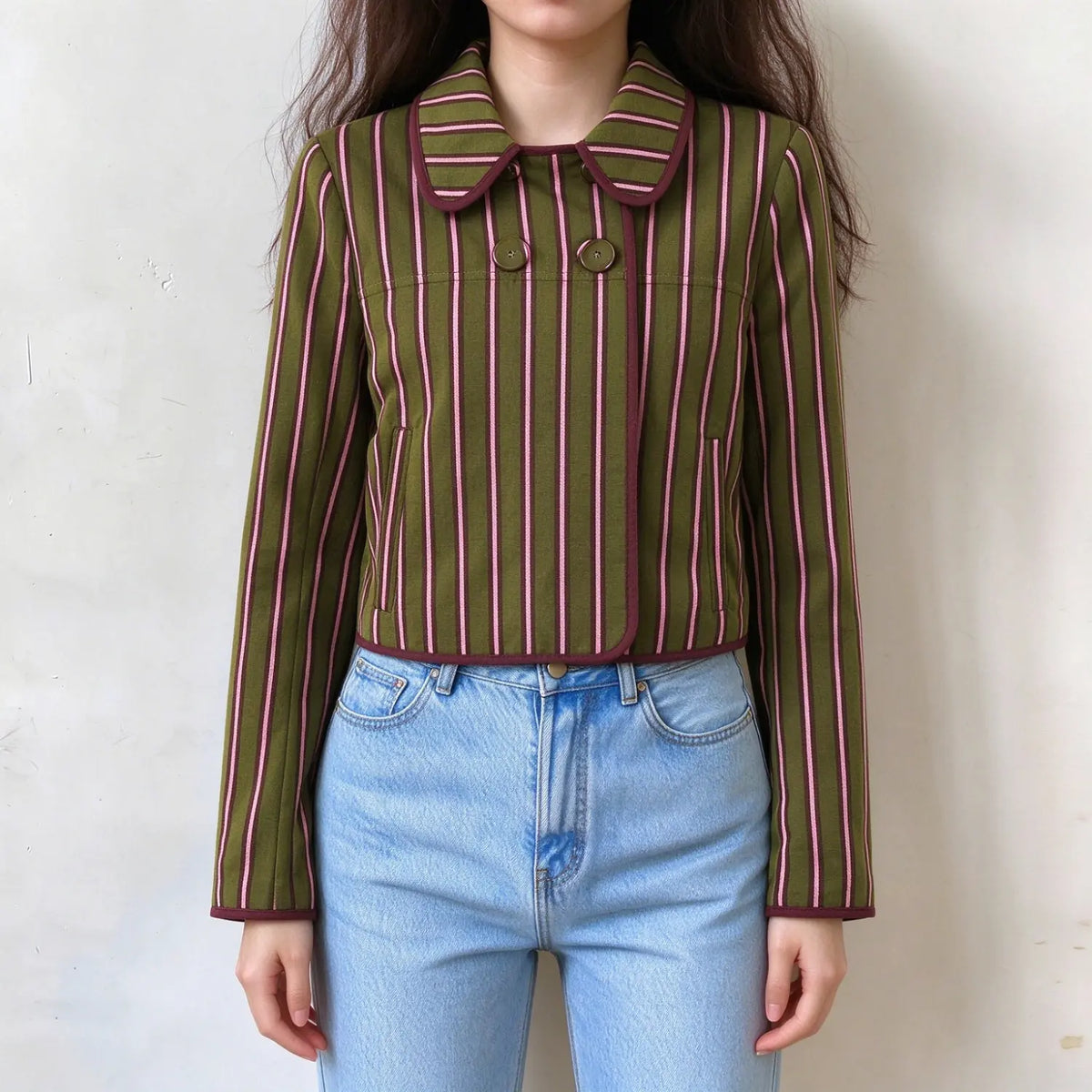 Model wearing striped peter pan collar cropped jacket with jeans, front view