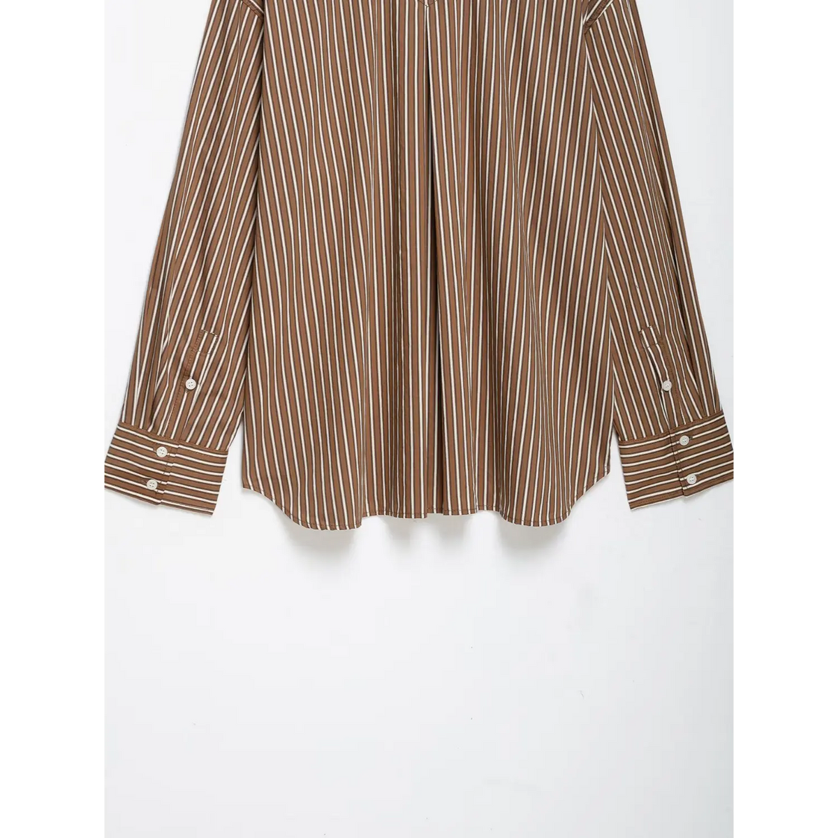 Close-up of back cuffs and curved hem