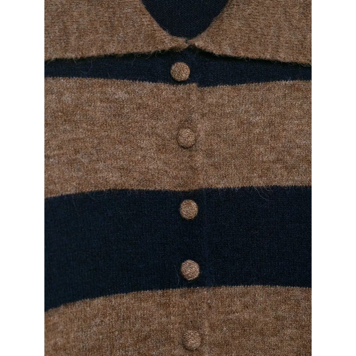 Close-up of brown navy striped fabric covered button