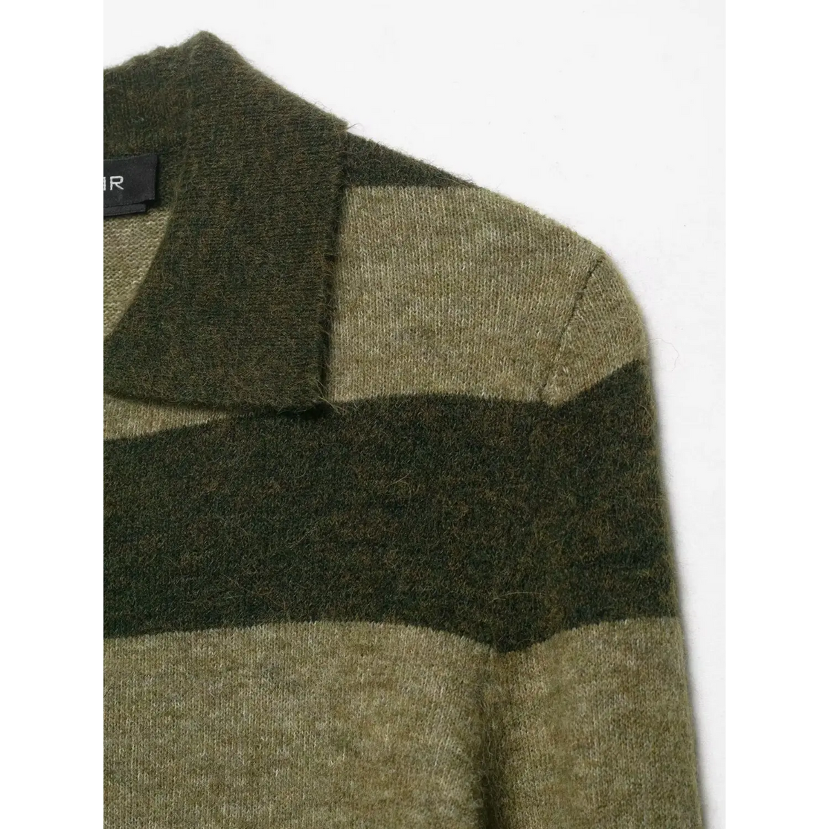Close-up of olive striped shoulder and inner label