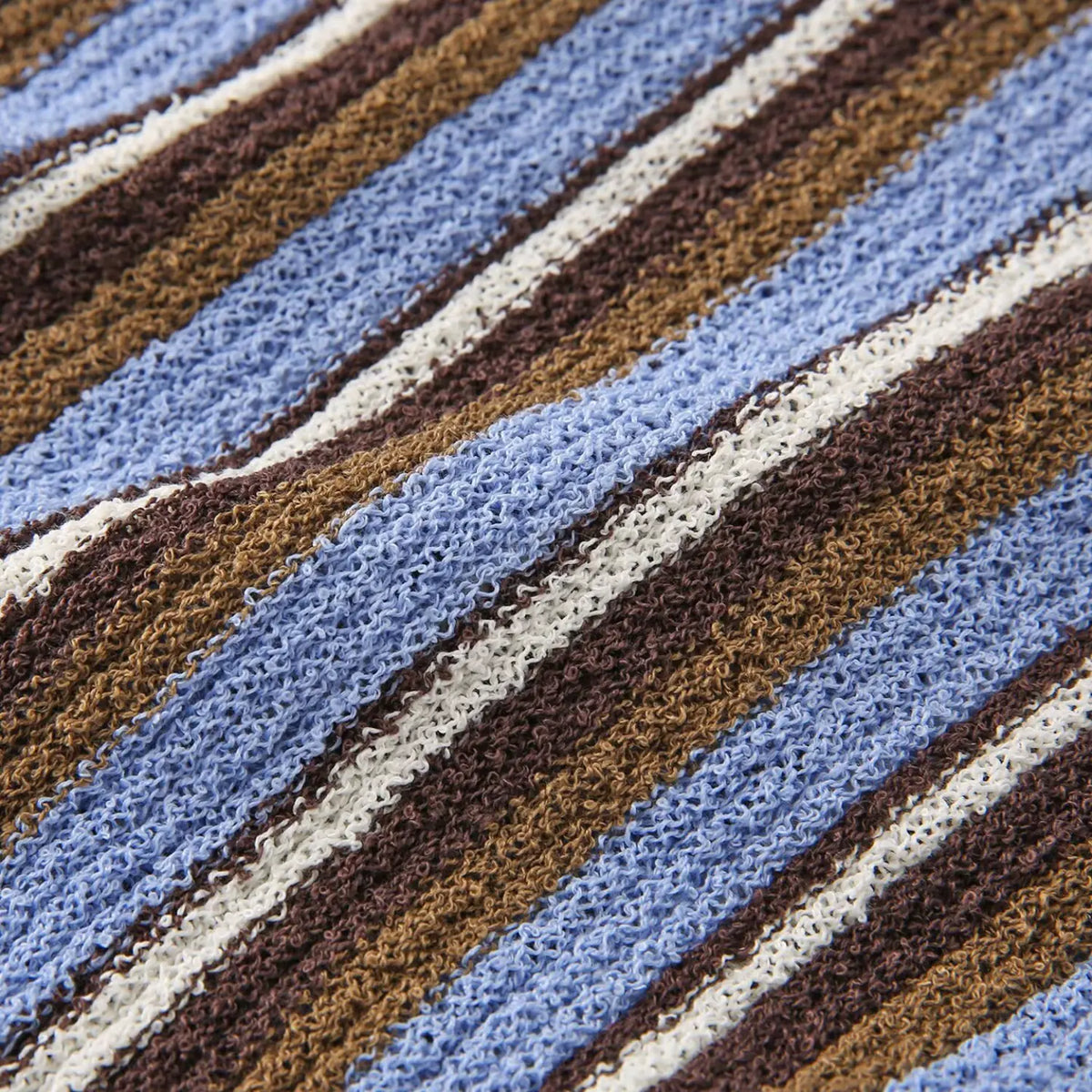 Close-up of blue brown striped crinkle knit texture