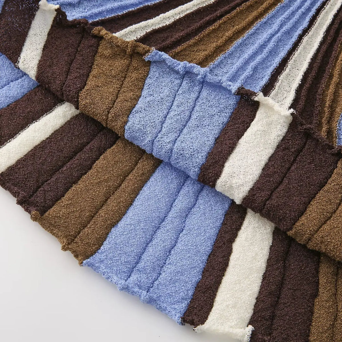 Close-up of blue brown striped A-line skirt flow