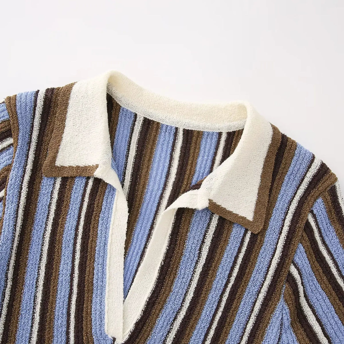 Close-up of blue brown striped contrast polo collar