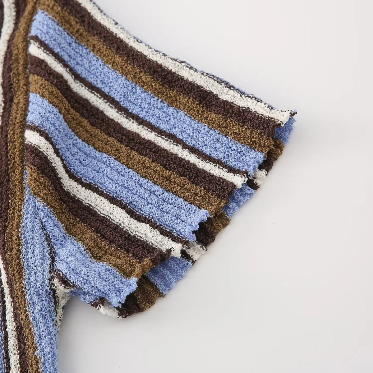 Close-up of blue brown striped short sleeve cuff