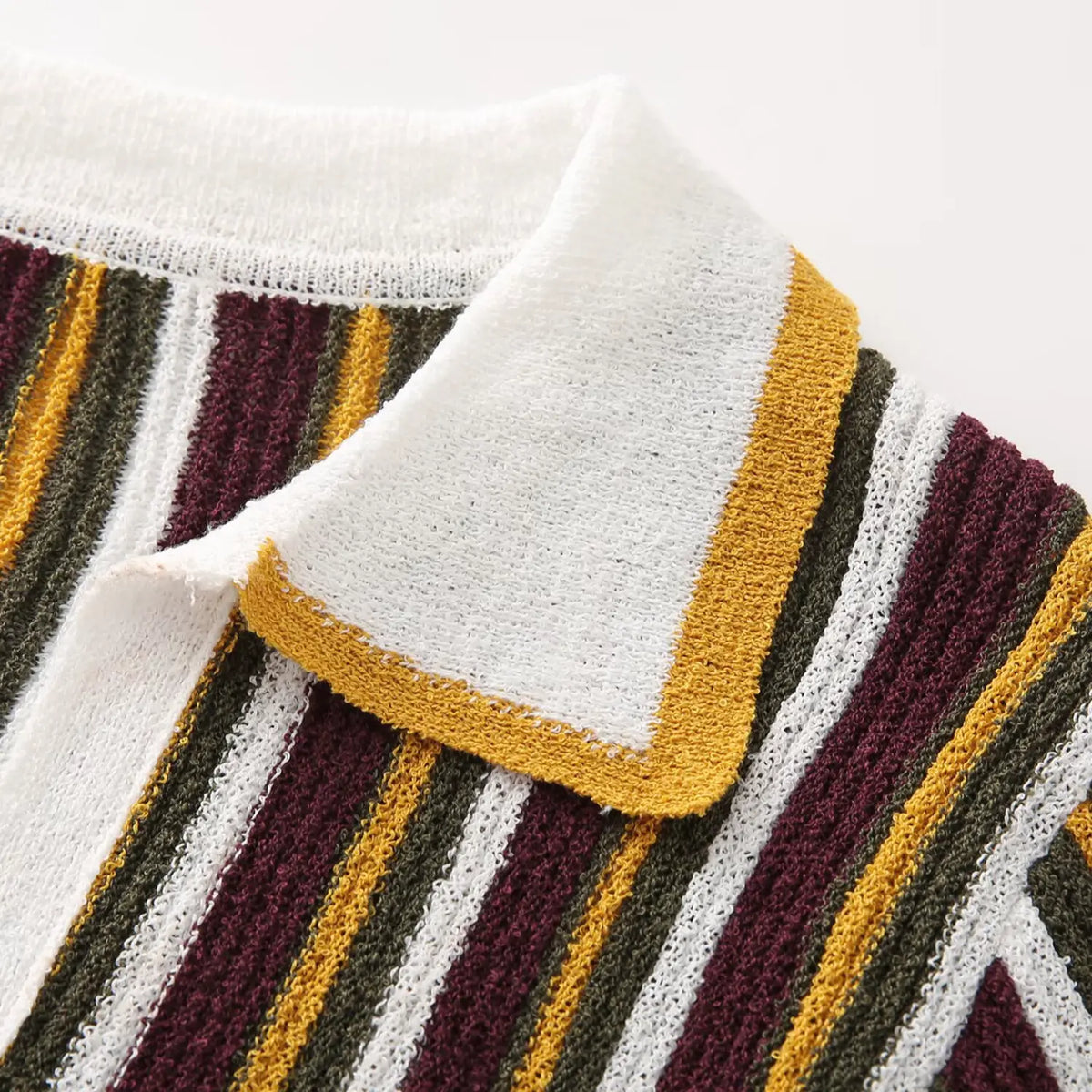 Close-up of burgundy olive striped collar point and yellow trim