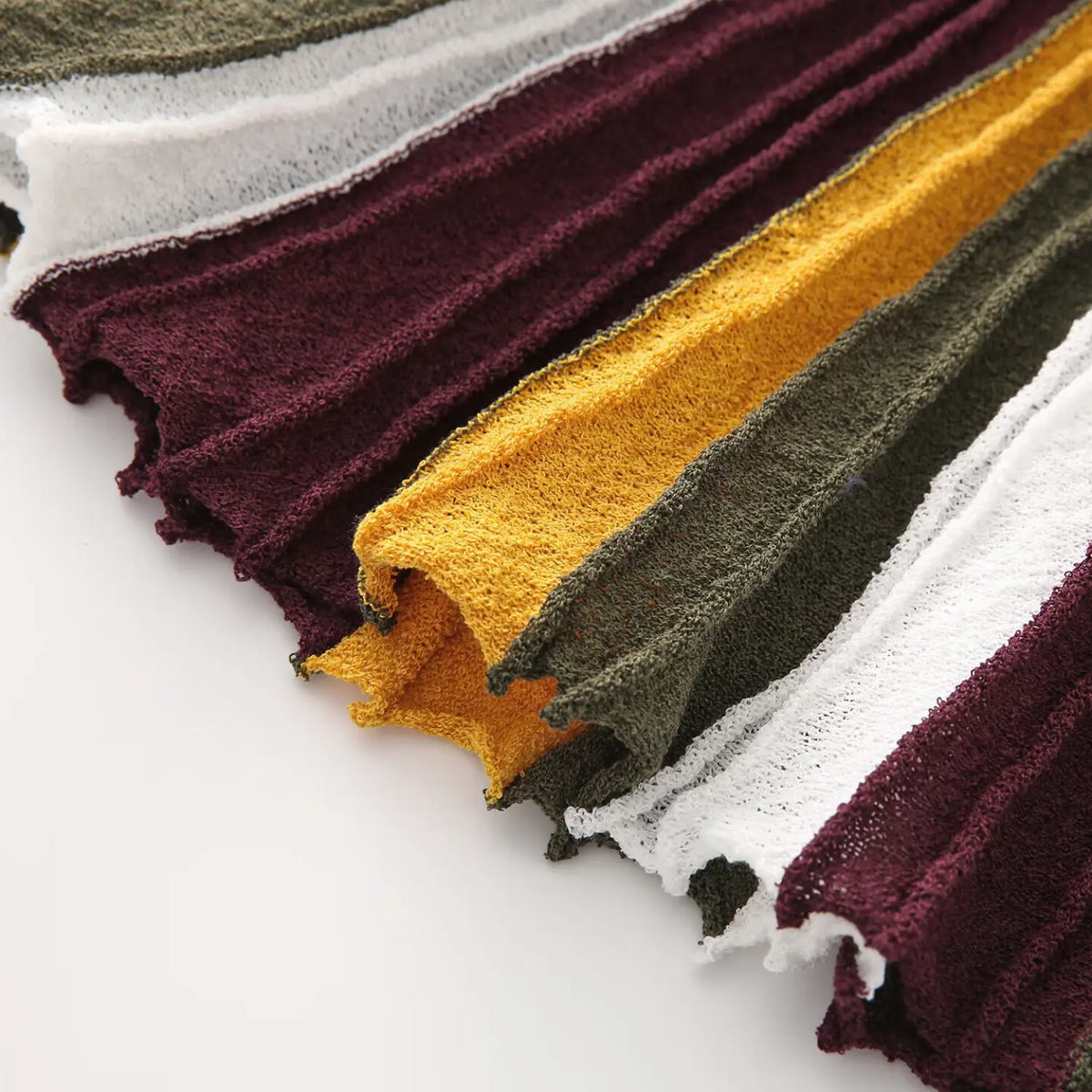 Close-up of burgundy olive striped A-line skirt flow