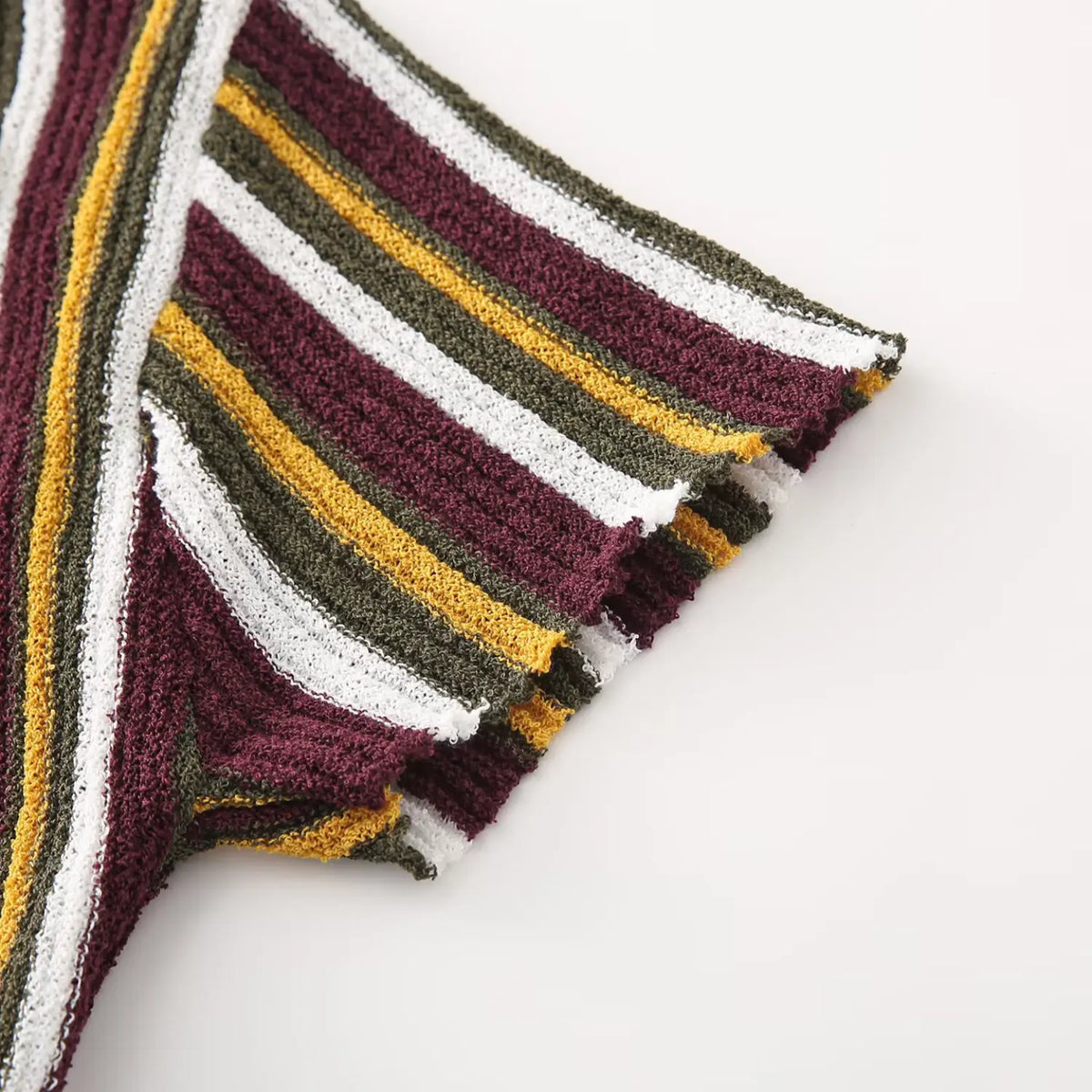 Close-up of burgundy olive striped short sleeve cuff