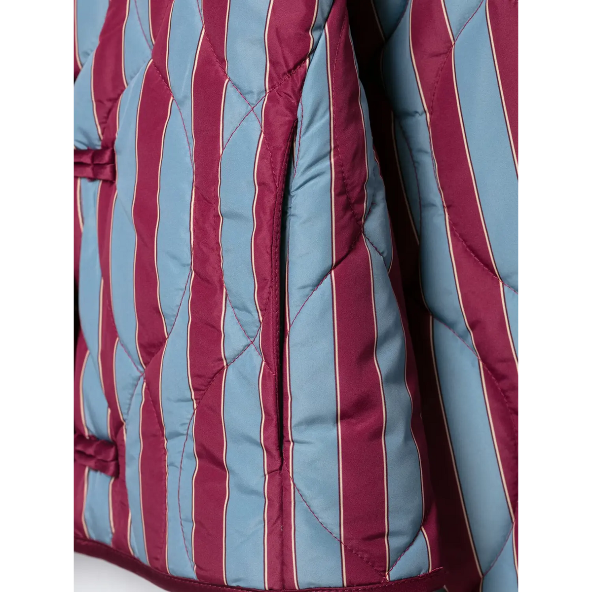 Close-up of side seam and diamond quilted stitch on striped jacket