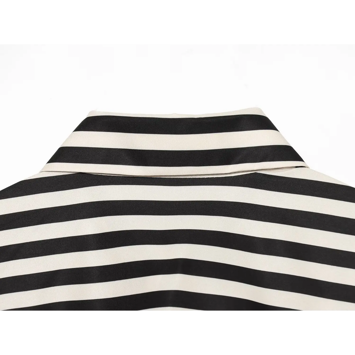 Close‑up of back collar and yoke, horizontal black‑cream striped woven fabric, clean seam finish