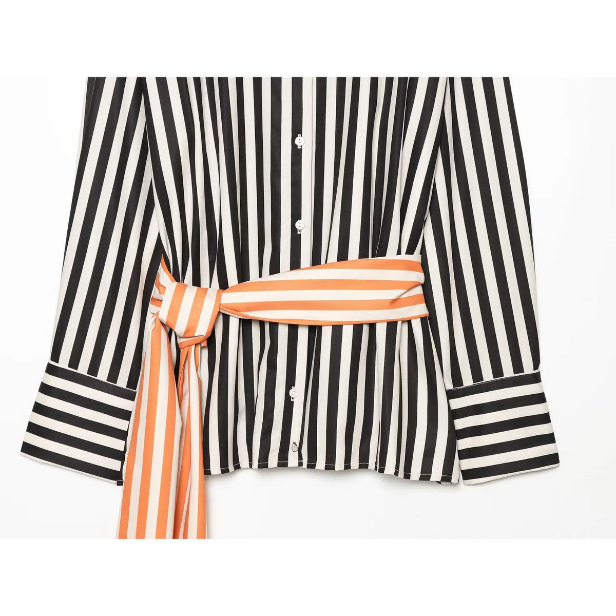 Close‑up of waist area, orange‑cream horizontal striped wrap tie belt knotted on black‑cream vertical stripe long sleeve shirt