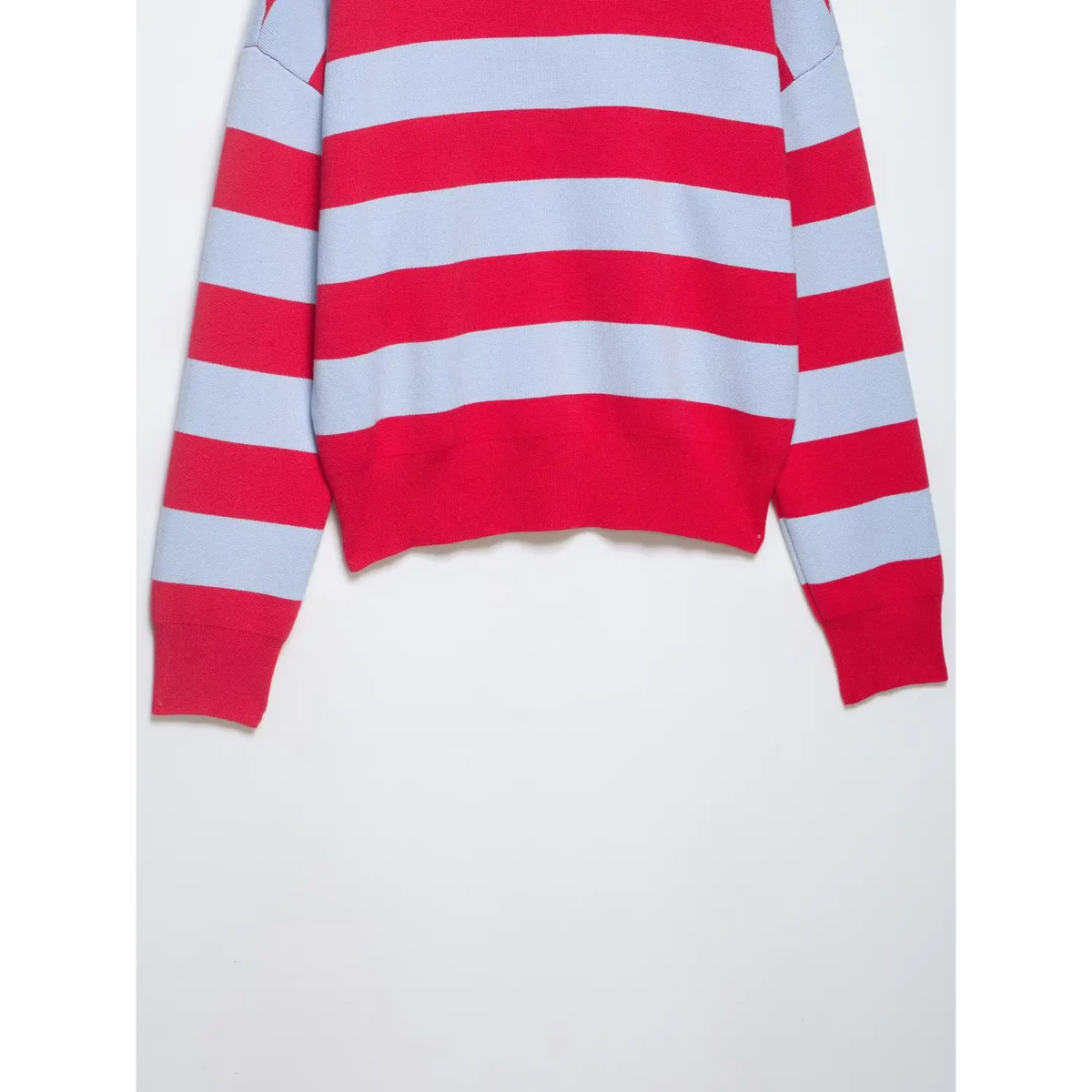 Close-up of red ribbed hem and ribbed cuffs