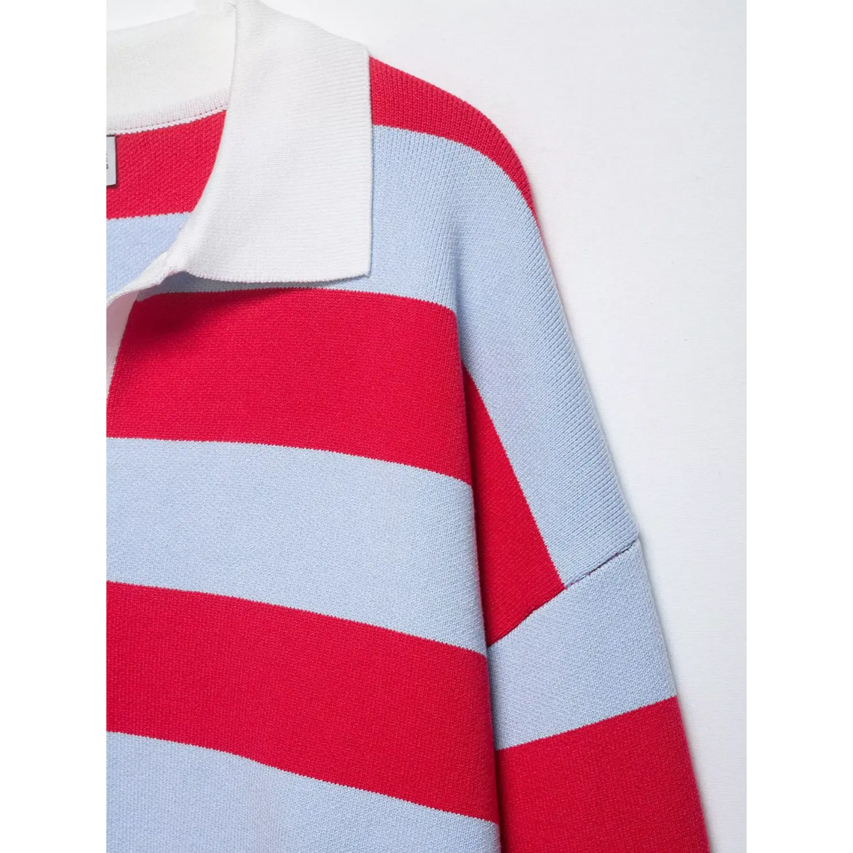 Close-up of white collar and drop shoulder seam