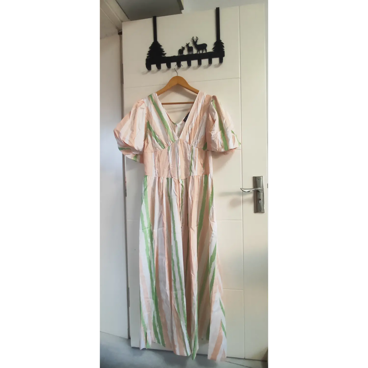 Brushstroke stripe maxi dress with v-neckline, puff sleeves and flowy long skirt, full front hanging view