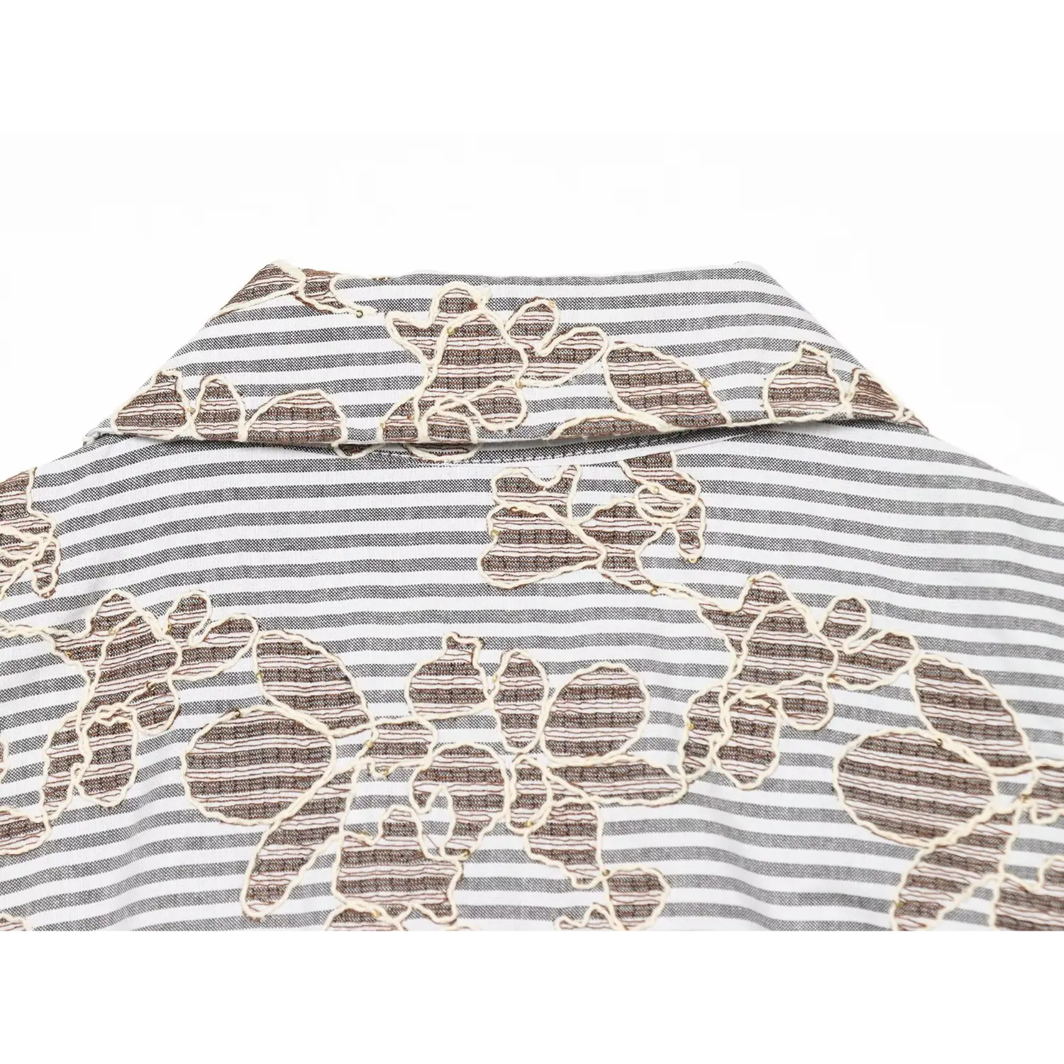 Back collar close‑up, showing striped base and brown floral embroidery texture