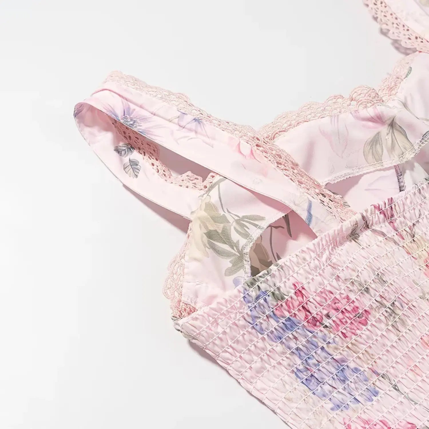 Front sweetheart bust macro shot, delicate scalloped lace edging, padded molded cups, scattered watercolor flower print
