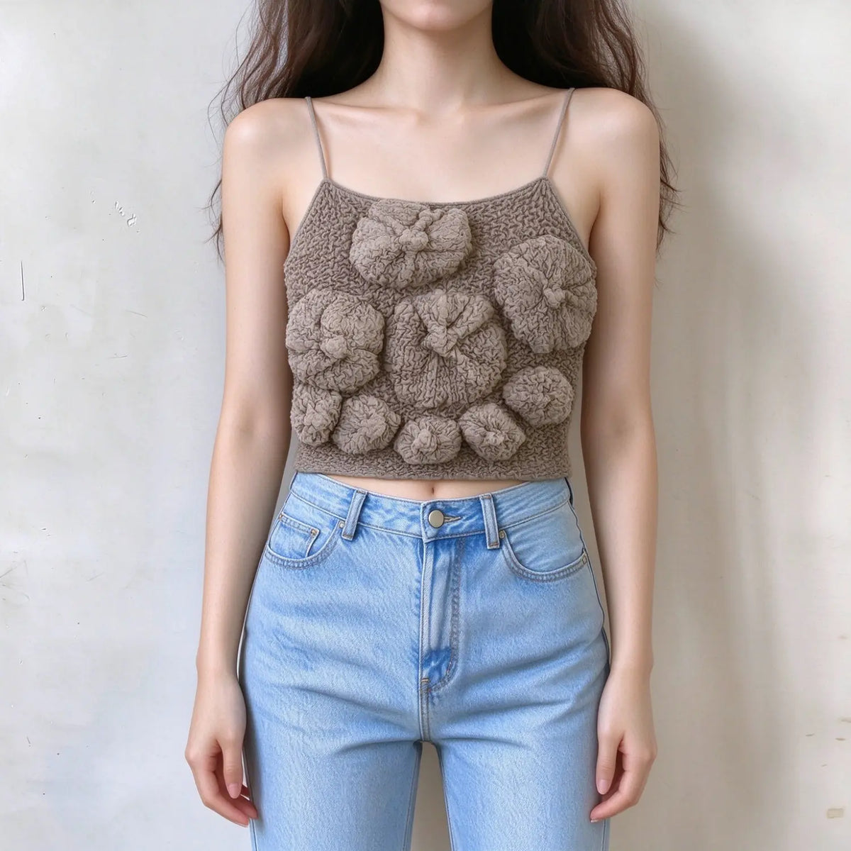 Model wearing taupe crochet cami top, thin spaghetti straps, square neck, handmade 3D floral applique, textured knit fabric, cropped slim fit