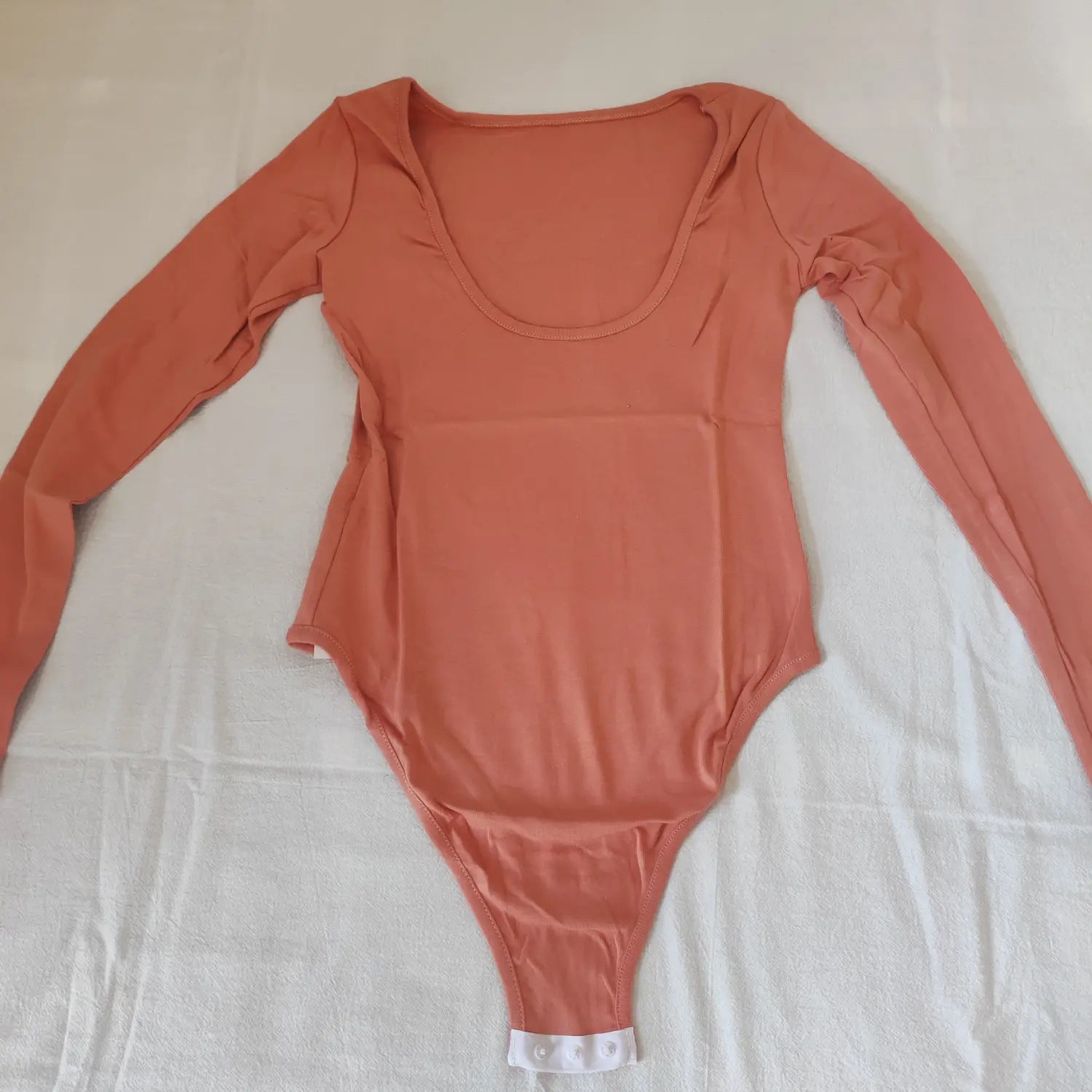 Flat lay back view terracotta solid long sleeve fitted scoop neck bodysuit